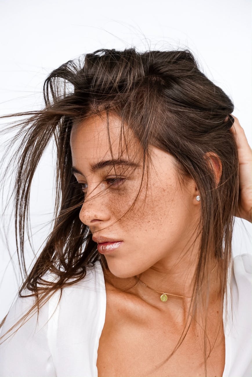 close up photo of woman wearing white top